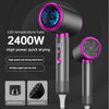 A black professional hair dryer with a purple LED temperature halo and a wide nozzle is shown.