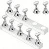 A set of silver magnetic nail art display stands arranged on a white rectangular stand.