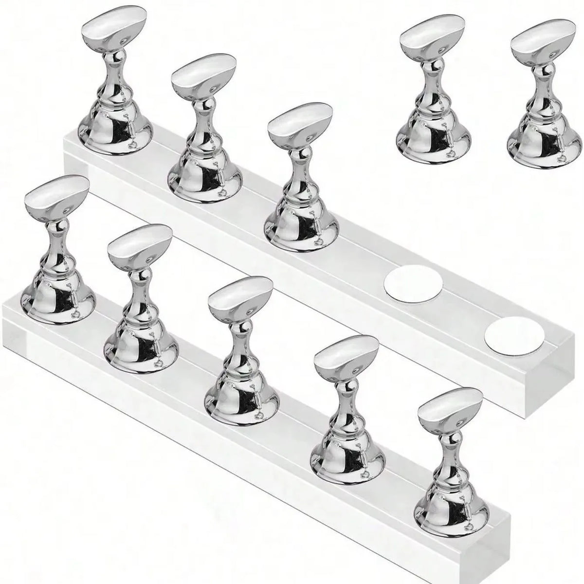 A set of silver magnetic nail art display stands arranged on a white rectangular stand.