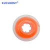 A clear plastic rubber band with an orange, coiled elastic interior used for dental orthodontic purposes.
