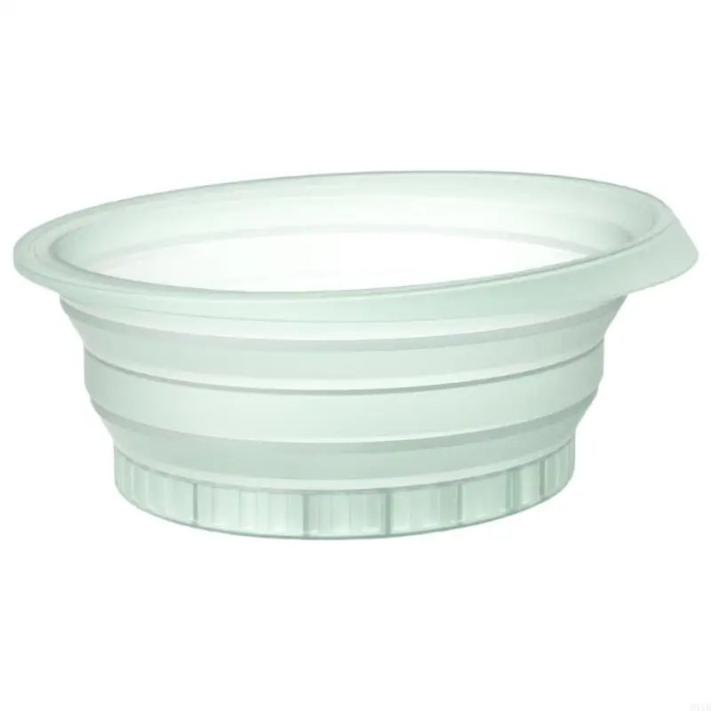 A clear silicone foldable ice bath bowl used for facial plunge.