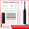 Pink and black electric toothbrush set with charging cable and accessories for oral hygiene