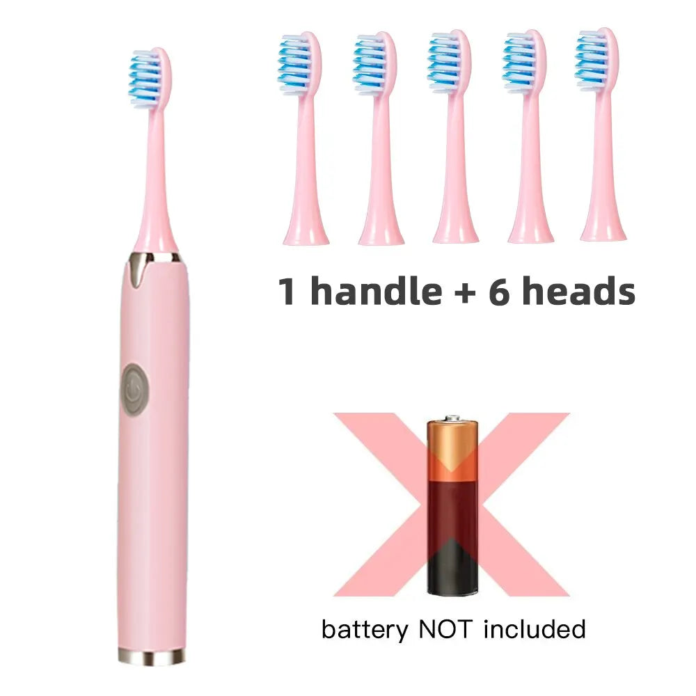 Pink sonic electric toothbrush with one handle and six replacement brush heads shown next to an empty battery.