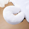 White reusable U-shaped pillow covers used for massage and beauty treatments