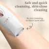 A white electric hair trimmer is shown being used for skin-close cleansing on an arm.