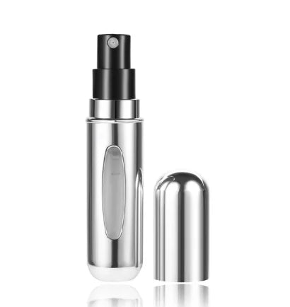 A silver portable mini perfume refill spray bottle with a black pump dispenser.
