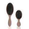 A pair of matte boar bristle hair extension brushes shown against a white background.