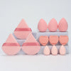 A set of twelve pink makeup sponges arranged in rows on a white surface.