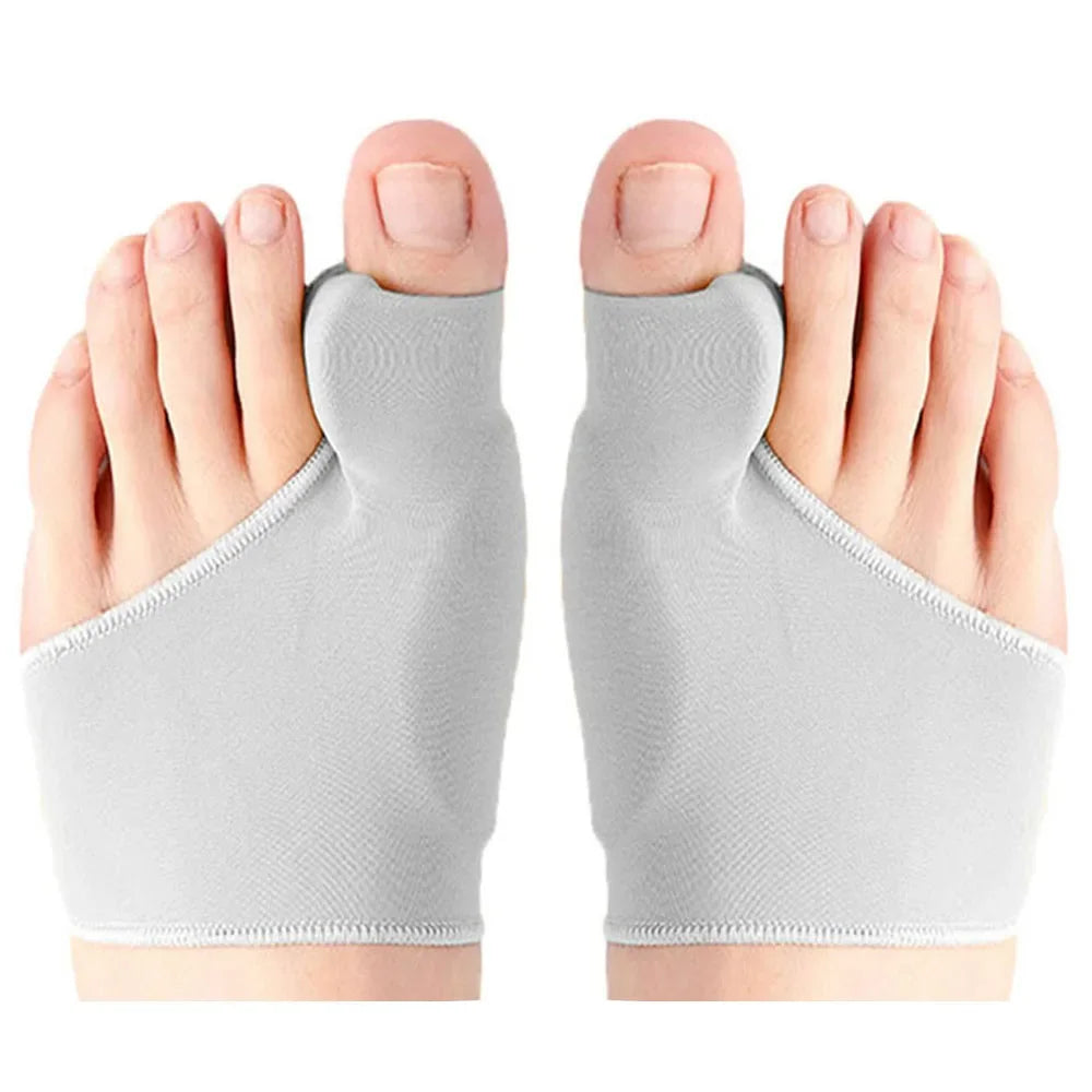 A pair of gray orthopedic toe separators and corrector pads shown from the top view.
