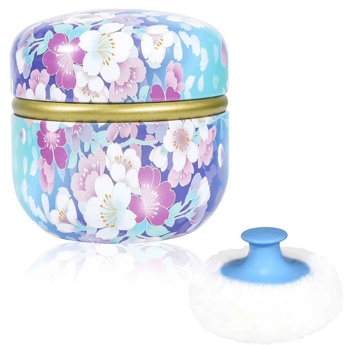 Poudrier portable rond bleu clair et violet à motifs avec bord doré.