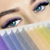 Close-up of a woman's eye showing natural look brown eyelash clusters in various shades.
