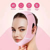 A woman is wearing a pink V-face shaping strap designed for jawline and double chin contouring.