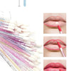 A collection of crystal lip brushes and lash spoolies in various colors and shades for makeup application.