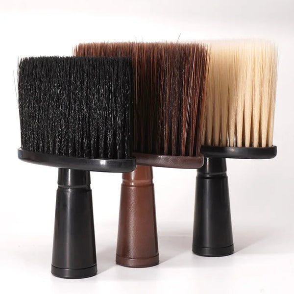 Three hair duster brushes in black, brown, and blonde bristles displayed on a stand.