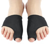 A pair of black orthopedic toe separators and corrector set shown on a foot.