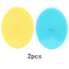 Two silicone facial cleansing brushes, one yellow and one blue, for deep pore cleansing.