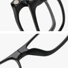 A close-up view of a black magnetic attraction design reading glasses frame with a comfortable nose rest.