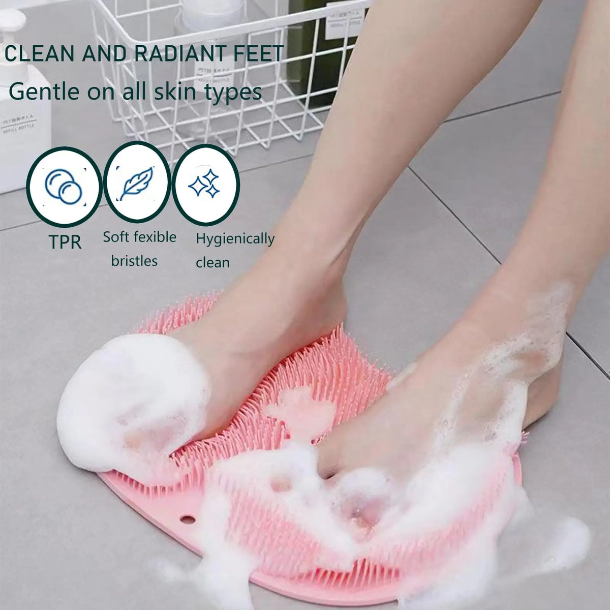 Pink silicone foot scrubber and exfoliating bath sponge set being used on a person's foot.