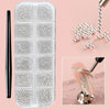 A clear plastic case containing various gold mixed stainless steel bead nail art decorations and a black nail tool.