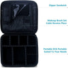 Black portable makeup organizer bag with zippered sandwich and dedicated spaces for makeup brush sets and cables