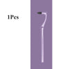 A clear manual tooth stain remover tool with a curved plastic handle and a small brush tip.