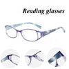 A pair of purple-tinted reading glasses shown from the front and side views.