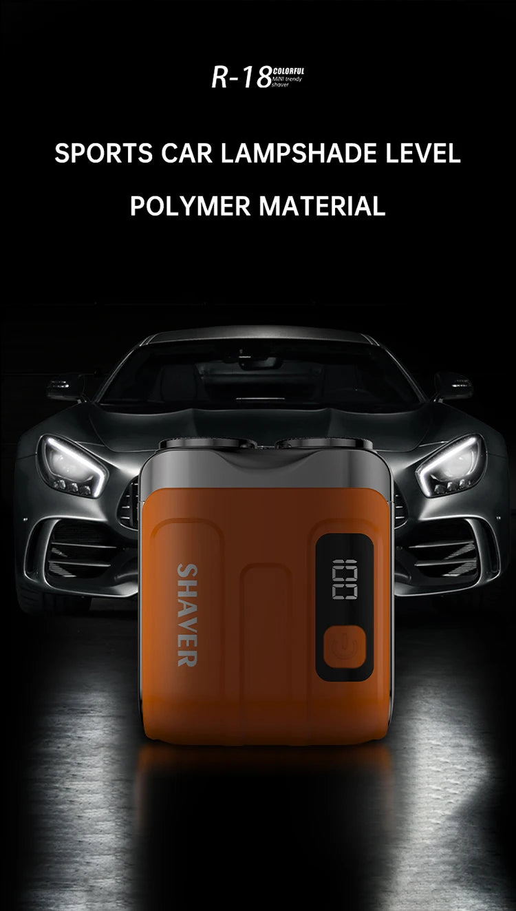 An orange electric shaver with a clear level indicator is shown in front of a black sports car.