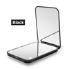 A black portable LED magnifying makeup mirror shown in an open, flat display.
