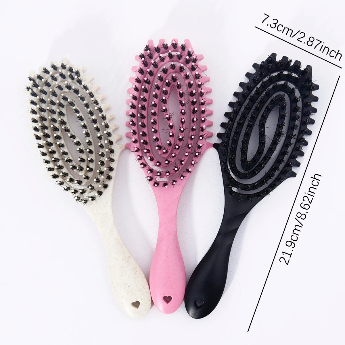 Three hair styling combs with pink and black bristles shown next to a measurement ruler.