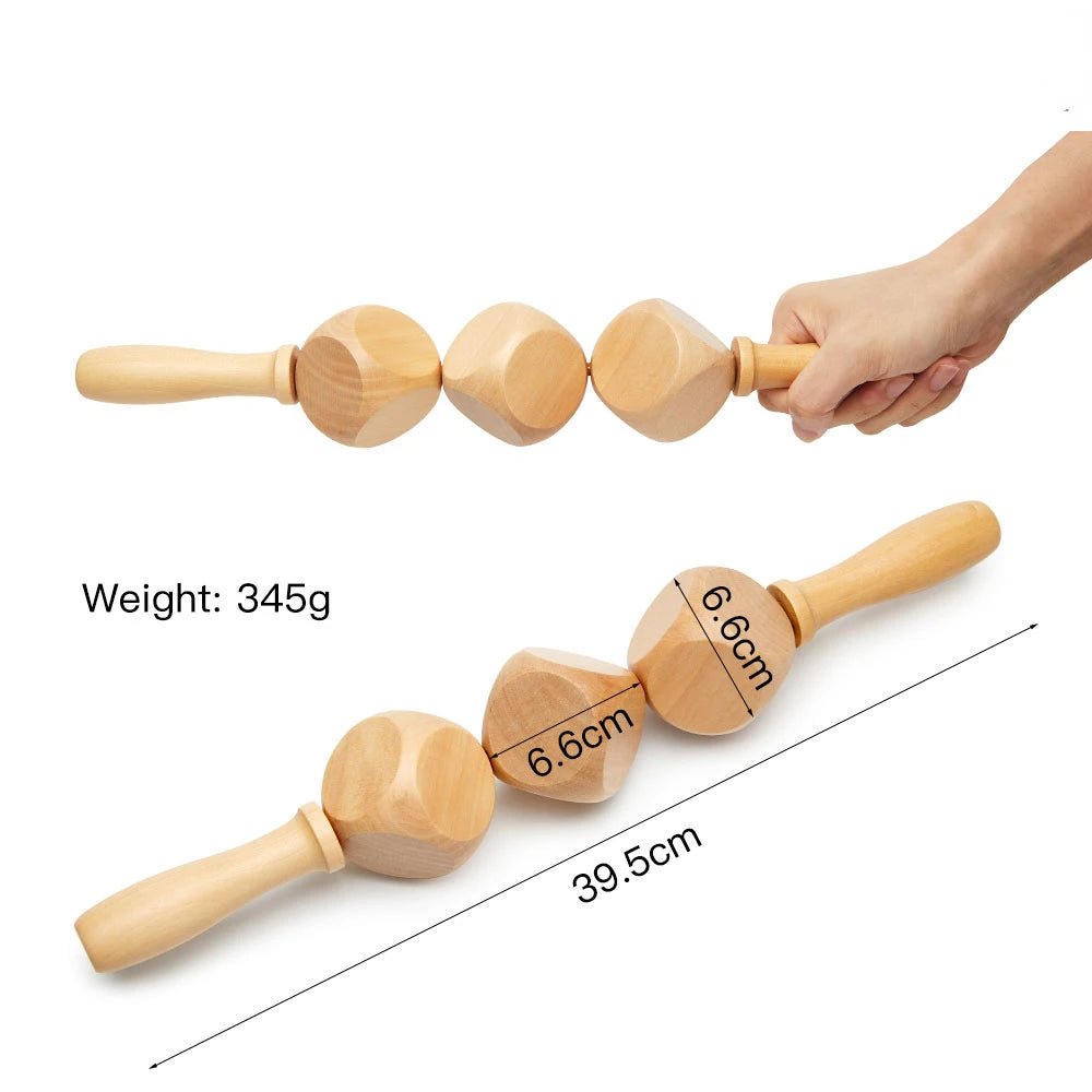 A natural wood gua sha roller with a handle and multiple rounded stones, shown being held by a hand.