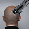 A professional cordless hair clipper is shown being used on the back of a person's head.