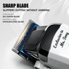 A close-up of a black and silver electric hair clipper with a sharp blade and moving blade assembly.