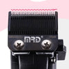 A close-up view of a black professional cordless hair clipper with a metal comb and branding.