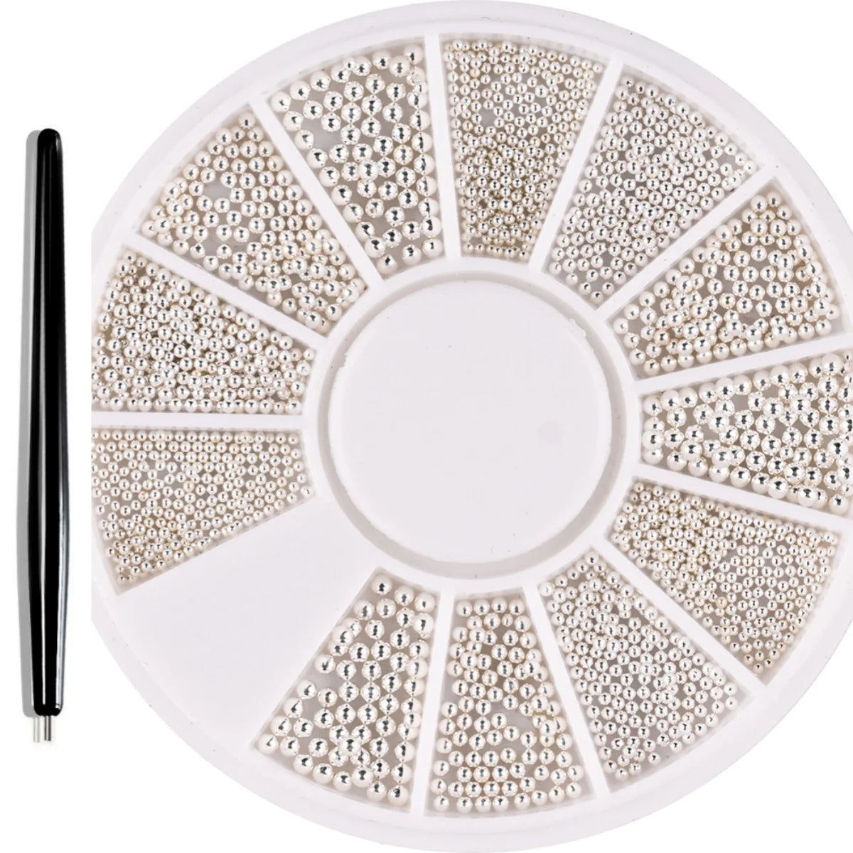 A circular plate of gold mixed stainless steel bead nail art decorations is shown with a black tool.
