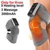 A gray electric knee massager and heat therapy pad is shown on a person's knee.