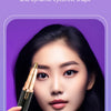A woman is using a black electric facial hair remover tool to shape her eyebrows.