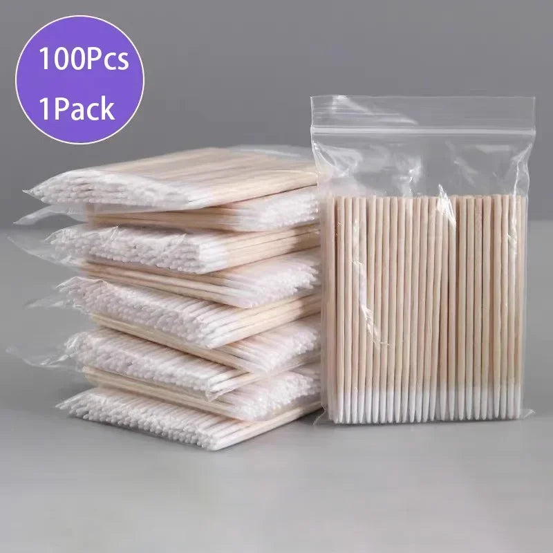 Paquete de 100 palitos de madera para manicura y cuidado de cutículas, en bolsa de plástico transparente.
