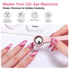 A hand applies a pink magnetic cat eye nail art stick to a fingernail for a manicure.