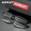 A pair of gray rectangular eyeglasses resting on a dark surface with a red Supkley logo box in the background.