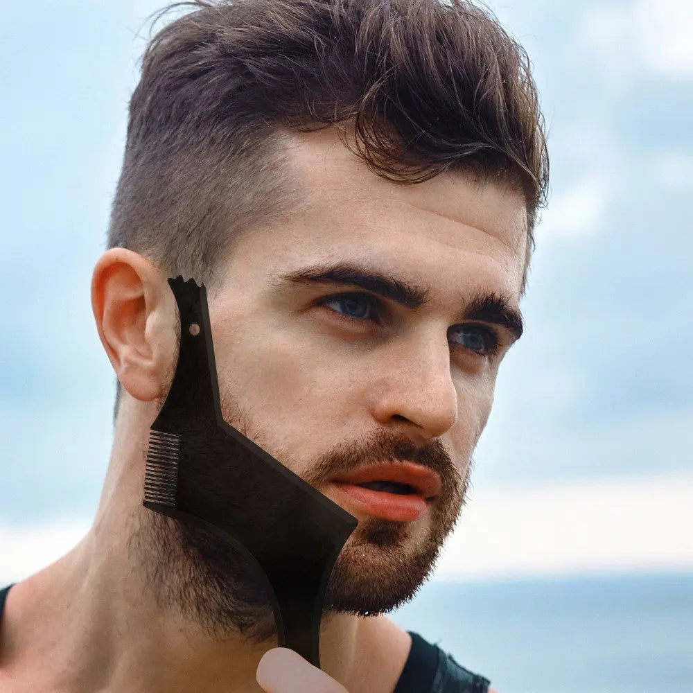 A man is shown using an All-in-One Beard Styling Template and Comb on his face outdoors.