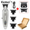 A Kemei cordless electric hair trimmer with multiple attachments and a box.