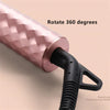 A pink ceramic hair curling iron with a black handle, shown rotating 360 degrees.