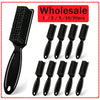 A set of black plastic and nylon cleaning brushes for various household tasks.