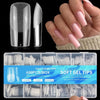 A box of 600 clear acrylic nail tips is shown alongside a hand displaying finished nails.