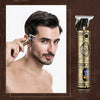 A man is using a multi-function electric grooming kit for facial hair on his face.