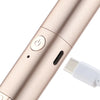 A close-up view of a rose gold electric heated eyelash curler and eyebrow trimmer with a charging port.