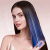 A woman is using a pink cordless split hair clipper to trim and repair broken hair strands.