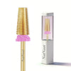 A gold-colored nail drill bit set with a pink and white storage case containing a gold drill bit.