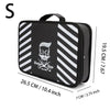 Black and white striped professional barber tool storage bag with a handle