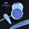 A small jar of iridescent blue glitter nail powder next to a white applicator brush on a black background.